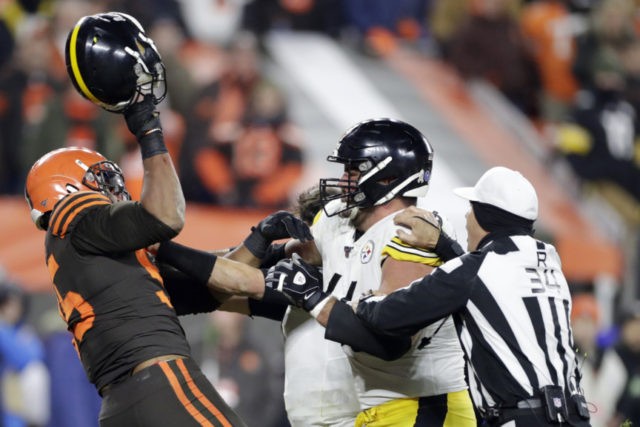 Garrett Attack Photo Gallery Cleveland Browns defensive end Myles Garrett, left, gets ready to hit Pittsburgh Steelers quarterback Mason Rudolph, second from left, with a helmet during the second half of an NFL football game, Thursday, Nov. 14, 2019, in Cleveland. (AP Photo/Ron Schwane) The Associated Press