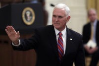The Latest: Pence makes unannounced visit to Iraq