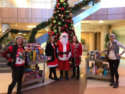 Members of Braylonstrong, a brain tumor foundation, pose before passing out toys on Sunday, Dec. 22, 2019, at St. Joseph Mercy Health System's pedatric unit. Photo courtesy of Jennifer Abraham.