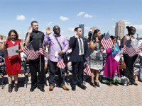 A group of people take the oath of allegiance during their naturalization ceremony at Liberty State Park, Monday, July 4, 2016, in Jersey City, N.J. Nearly two dozen new U.S. citizens took their oaths of allegiance at the ceremony. The 21 new citizens came from 17 countries: Bangladesh, Bosnia-Herzegovina, Colombia, …