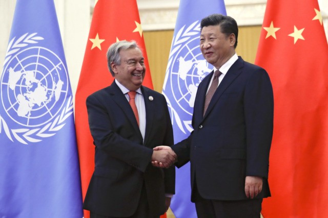 United Nations Secretary-General Antonio Guterres, left, shakes hands with Chinese President Xi Jinping before their bilateral meeting at the Great Hall of the People in Beijing, Sunday, Sept. 2, 2018. (AP Photo/Andy Wong, Pool)