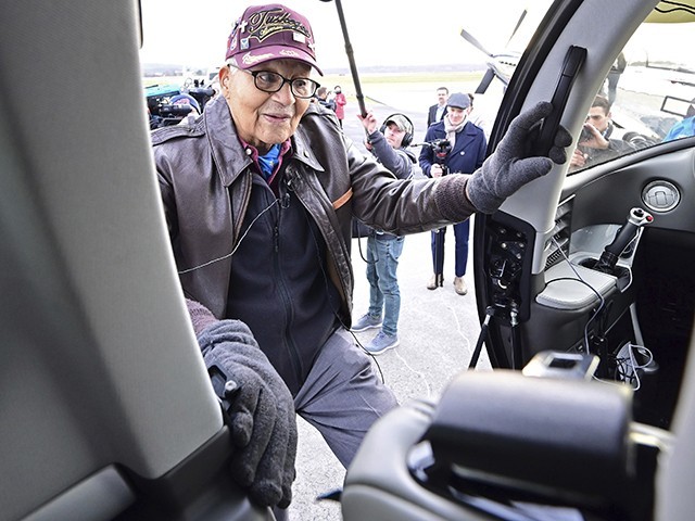 Retired U.S. Air Force Col. Charles McGee, a decorated Tuskegee Airman who flew in three wars, boards a Cirrus SF50 Vision Jet for a round trip flight to Dover Air Force Base in Delaware to help celebrate his 100th birthday, in Frederick, Maryland, Friday, Dec. 6, 2019. McGee's birthday is Dec. 7. (AP Photo/David Tulis)
