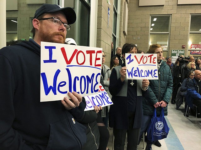 Residents in support of continued refugee resettlement hold signs at a meeting in Bismarck, N.D., Monday Dec. 9. 2019. Several church leaders are urging Burleigh County not to be the nation's first to refuse new refugees since President Donald Trump ordered that states and counties should have the power to …