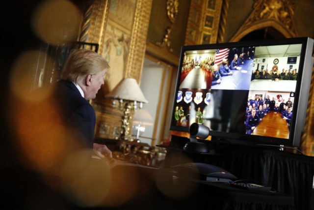 President Donald Trump speaks during a Christmas Eve video teleconference with members of