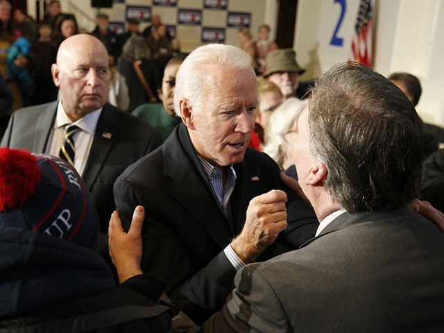 Democratic presidential candidate former Vice President Joe Biden greets a potential supporter at a campaign stop on Sunday, Dec. 29, 2019, in Peterborough, N.H. (AP Photo/Mary Schwalm)