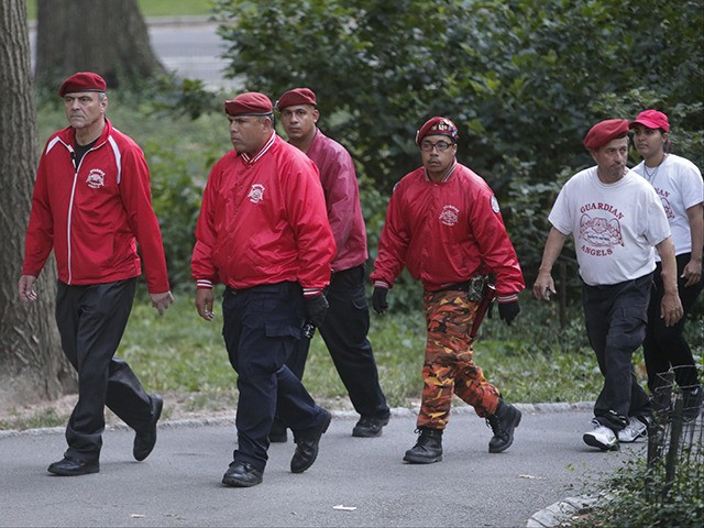 Guardian Angels founder Curtis Sliwa leads members of the Guardian Angles through Central