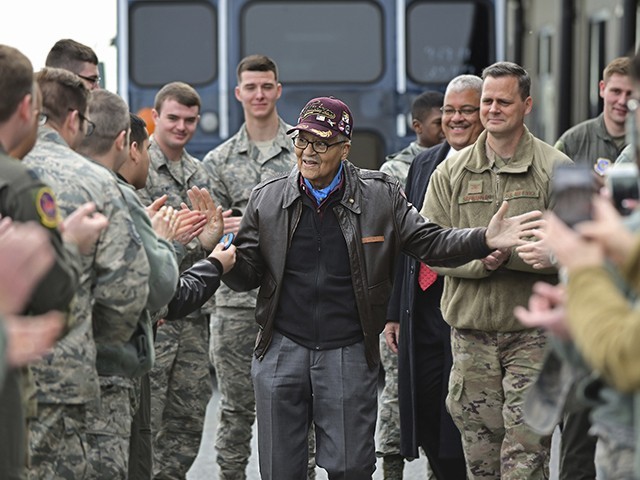 Retired U.S. Air Force Col. Charles McGee (center), a decorated veteran of three wars, receives a congratulatory a send off after visiting with 436 Aerial Port Squadron personnel at Dover Air Force Base to help celebrate his 100th birthday in Dover, Delaware, Friday, Dec. 6, 2019. McGee's birthday is Dec. 7. (AP Photo/David Tulis)
