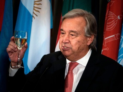 UN Secretary-General Antonio Guterres makes a toast during a luncheon at the United Nation