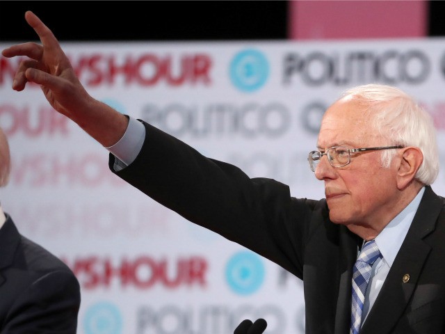Sen. Bernie Sanders (I-VT) raises his hand during the Democratic presidential primary debate at Loyola Marymount University on December 19, 2019 in Los Angeles, California. Seven candidates out of the crowded field qualified for the 6th and last Democratic presidential primary debate of 2019 hosted by PBS NewsHour and Politico. …