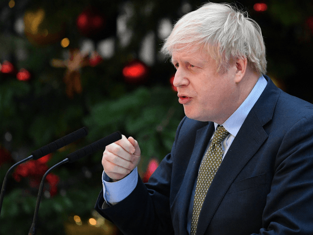 Britain's Prime Minister Boris Johnson delivers a speech outside 10 Downing Street in cent