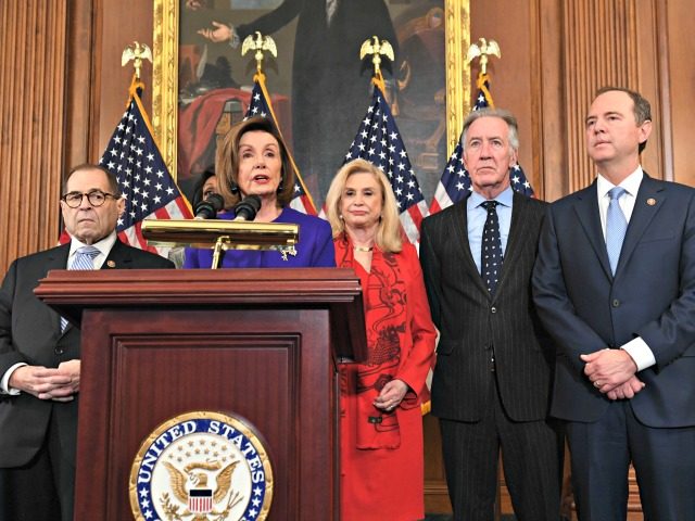 Speaker of the House Nancy Pelosi (C), flanked by House Permanent Select Committee on Inte