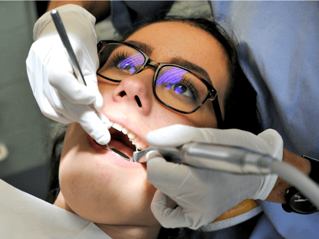 Dentist Hands and Tools