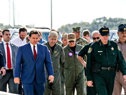PENSACOLA, FLORIDA - DECEMBER 06: Florida Governor Ron DeSantis (C) arrives for a press conference following a shooting on the Pensacola Naval Air Base on December 06, 2019 in Pensacola, Florida. The second shooting on a U.S. Naval Base in a week has left three dead plus the suspect and …