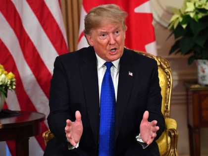 US President Donald Trump speaks with Canada's Prime Minister Justin Trudeau during a meet