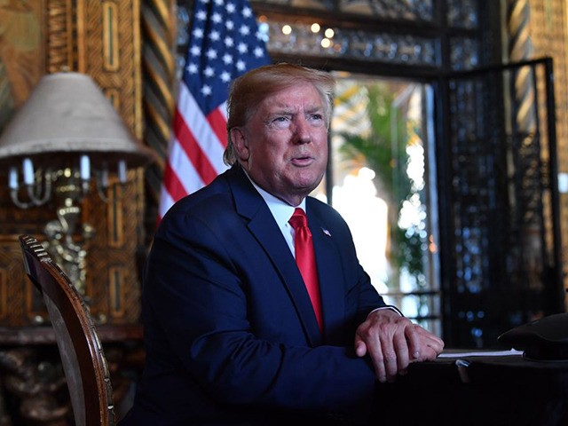 US President Donald Trump answers questions from reporters after making a video call to the troops stationed worldwide at the Mar-a-Lago estate in Palm Beach Florida, on December 24, 2019. (Photo by Nicholas Kamm / AFP) (Photo by NICHOLAS KAMM/AFP via Getty Images)