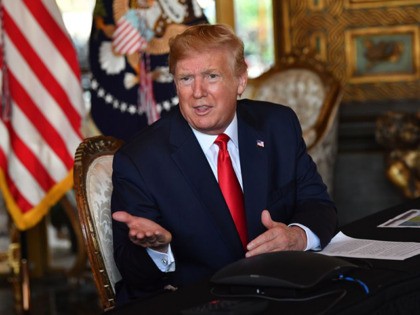 US President Donald Trump answers questions from reporters after making a video call to the troops stationed worldwide at the Mar-a-Lago estate in Palm Beach Florida, on December 24, 2019. (Photo by Nicholas Kamm / AFP) (Photo by NICHOLAS KAMM/AFP via Getty Images)