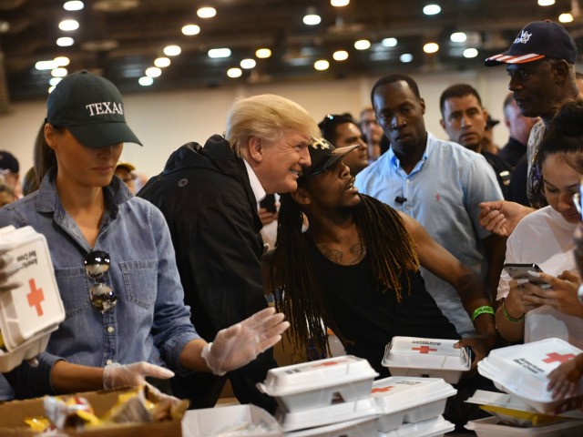 US President Donald Trump and First Lady Melania Trump serve food to Hurricane Harvey vict