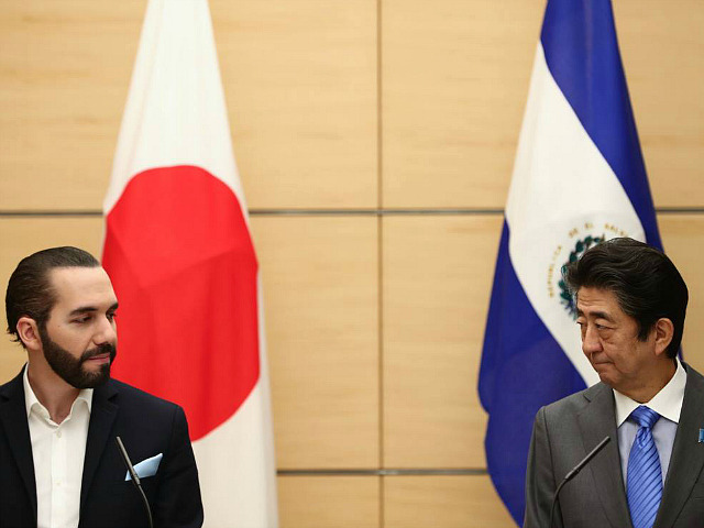 Japan's Prime Minister Shinzo Abe (R) and El Salvador President Nayib Bukele attend a join