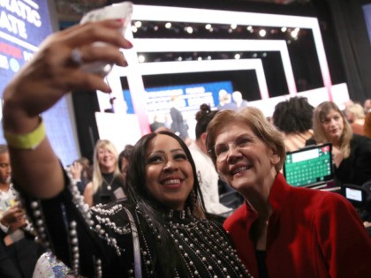 Sen. Elizabeth Warren (D-MA) takes a selfie with a member of the audience after the Democratic presidential primary debate at Loyola Marymount University on December 19, 2019 in Los Angeles, California. Seven candidates out of the crowded field qualified for the 6th and last Democratic presidential primary debate of 2019 …