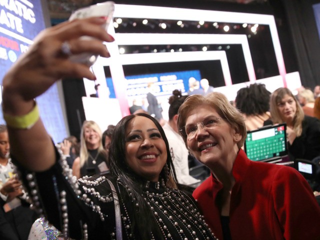 Sen. Elizabeth Warren (D-MA) takes a selfie with a member of the audience after the Democr