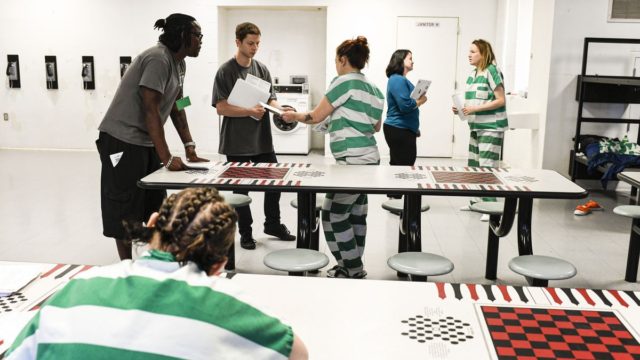 Inmates receive voter registration information from the Colorado Criminal Justice Reform C