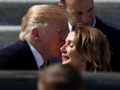 WASHINGTON, DC - MARCH 14: U.S. President Donald Trump kisses Speaker of the House Nancy Pelosi (D-CA) while departing the U.S. Capitol following a St. Patrick's Day celebration on March 14, 2019 in Washington, DC. Also pictured (L-R) are Rep. Richard Neal (D-MA), and Irish Taoiseach Leo Varadkar. (Photo by …