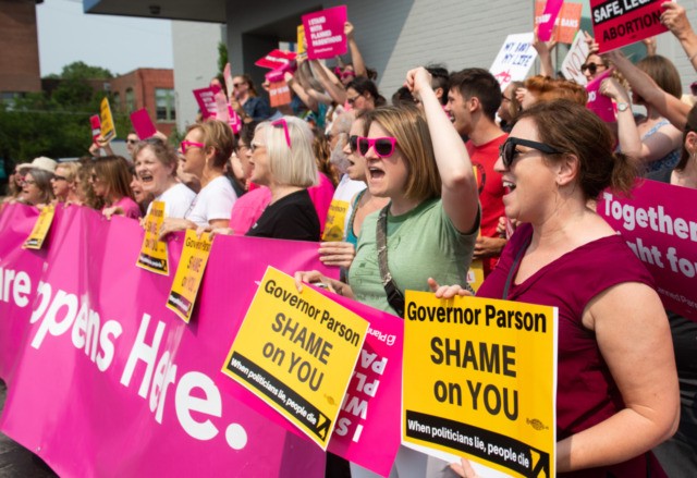 Pro-choice supporters and staff of Planned Parenthood hold a rally outside the Planned Parenthood Reproductive Health Services Center in St. Louis, Missouri, May 31, 2019, the last location in the state performing abortions. - A US Court on May 31, 2019 blocked Missouri from closing the clinic. (Photo by SAUL …