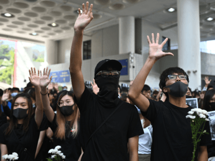 Students of the Hong Kong University of Science and Technology (HKUST) participate in a march towards HKUST president Wei Shyy's lodge in Hong Kong on November 8, 2019, following the death earlier in the day of student Alex Chow, 22, who was taken unconscious to hospital early on November 4 …