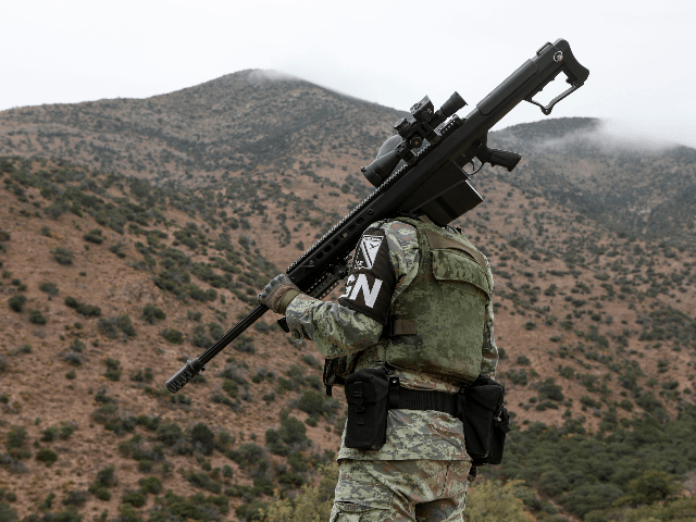 A member of the National Guard patrols the Sonora mountain range, where nine members of the LeBaron community were killed on Monday in the municipality of Bavispe, Sonora state, Mexico, on November 8, 2019. - The attack happened on an isolated dirt road in a region known for turf wars …