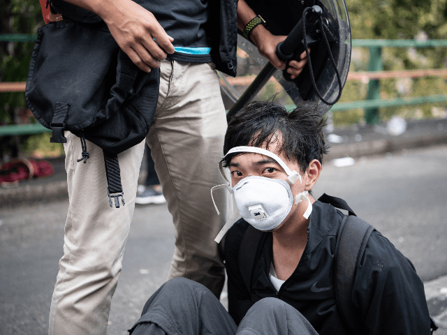 Police arrest anti-government protesters at Hong Kong Polytechnic University on November 18, 2019 in Hong Kong, China. Anti-government protesters armed with bricks, firebombs, and bows and arrows fought with the police at university campuses over the weekend as demonstrations in Hong Kong stretched into its sixth month with demands for …