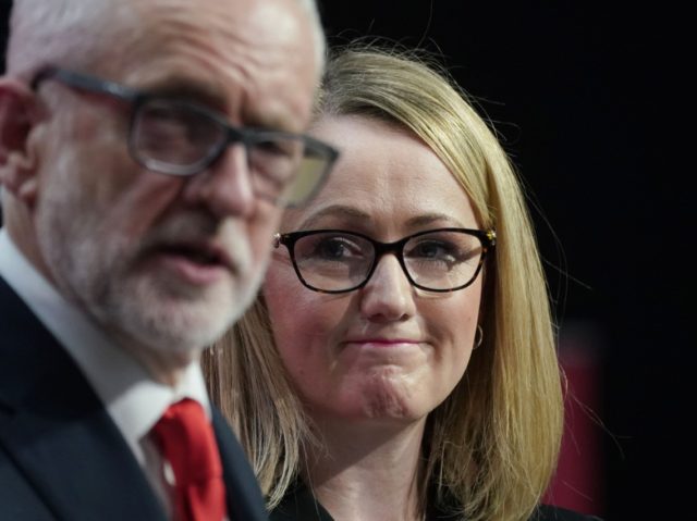 BIRMINGHAM, ENGLAND - NOVEMBER 21: Shadow business secretary Rebecca Long-Bailey looks on as Labour leader Jeremy Corbyn speaks during the launch of the party's election manifesto at Birmingham City University on November 21, 2019 in Birmingham, England. (Photo by Christopher Furlong/Getty Images)