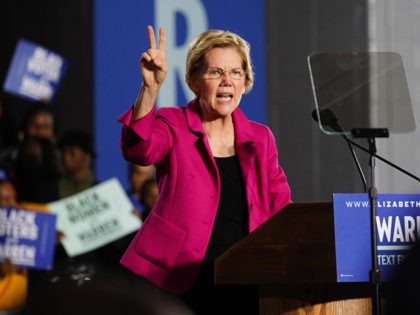 ATLANTA, GA - NOVEMBER 21: Democratic presidential candidate Sen. Elizabeth Warren (D-MA), holds up two fingers to represent her two-cent wealth tax while speaking at a campaign event at Clark Atlanta University on November 21, 2019 in Atlanta, Georgia. Warren, introduced by U.S. Rep. Ayanna Pressley (D-MA), spoke about workers' …