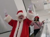 Santa Claus arrives down the esclolator at New York City's first-ever women's Nordstrom that spans seven stories on November 27, 2019 in New York City. (Photo by TIMOTHY A. CLARY / AFP) (Photo by TIMOTHY A. CLARY/AFP via Getty Images)
