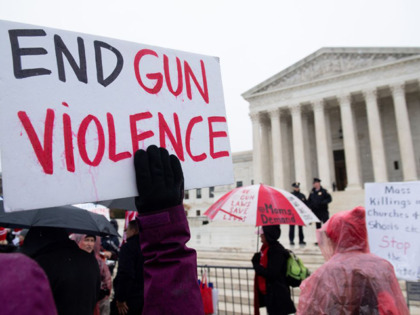 Supporters of gun control and firearm safety measures hold a protest rally outside the US Supreme Court as the Court hears oral arguments in State Rifle and Pistol v. City of New York, NY, in Washington, DC, December 2, 2019. - The case marks the first time in nearly 10 …