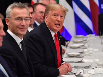 NATO Secretary General Jens Stoltenberg (L) looks on as US President Donald Trump gestures during a working lunch at the NATO summit at the Grove hotel in Watford, northeast of London on December 4, 2019. (Photo by Nicholas Kamm / AFP) (Photo by NICHOLAS KAMM/AFP via Getty Images)