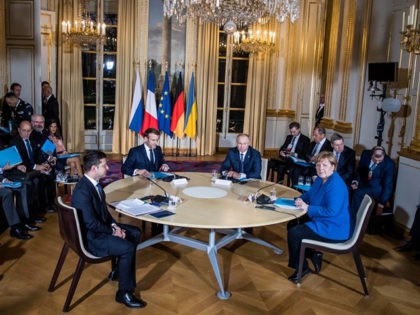 PARIS, FRANCE - DECEMBER 09: (L-R) Ukrainian President Volodymyr Zelensky, French President Emmanuel Macron, Russian President Vladimir Putin and German Chancellor Angela Merkel attend their summit on Ukraine at Elysee Palace on December 9, 2019 in Paris, France. The Normandy format was created in 2014 to resolve the conflict between …