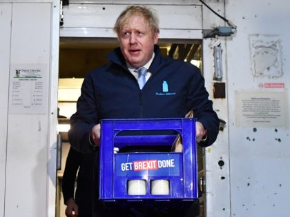 YEADON, UNITED KINGDOM - DECEMBER 11: Britain's Prime Minister Boris Johnson carries