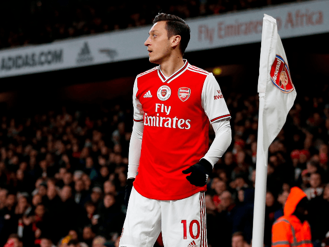 Arsenal's German midfielder Mesut Ozil prepares to take a corner during the English Premie