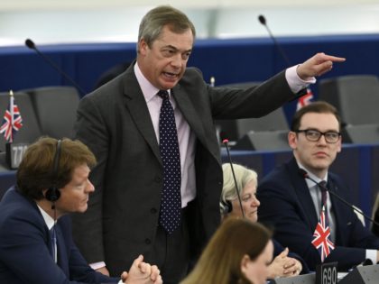 Brexit campaigner and Member of the European Parliament Nigel Farage (2ndL) gestures as he