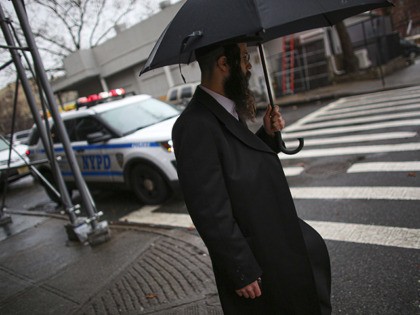 A NYPD car patrols in South Williamsburg Brooklyn on December 30, 2019 in New York City, two days after an intruder wounded five people at a rabbi's house in Monsey, New York during a gathering to celebrate the Jewish festival of Hanukkah. (Photo by Kena Betancur / AFP) (Photo by …