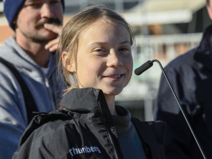 LISBON, PORTUGAL - DECEMBER 03: Swedish teen climate activist Greta Thunberg addresses supporters and journalists upon her arrival in Santo Amaro Recreation dock on December 03, 2019 in Lisbon, Portugal. Greta Thunberg sailed from Norfolk, Virginia, USA , accompanied by her father Svante Thunberg on the French built Outremer 45 …