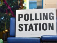 MANCHESTER, ENGLAND - DECEMBER 12: A Christmas tree is displayed in the foyer beside the entrance to the polling station at Roughtown Community Centre in Mossley on December 12, 2019 in Greater Manchester, England. The current Conservative Prime Minister Boris Johnson called the first UK winter election for nearly a …