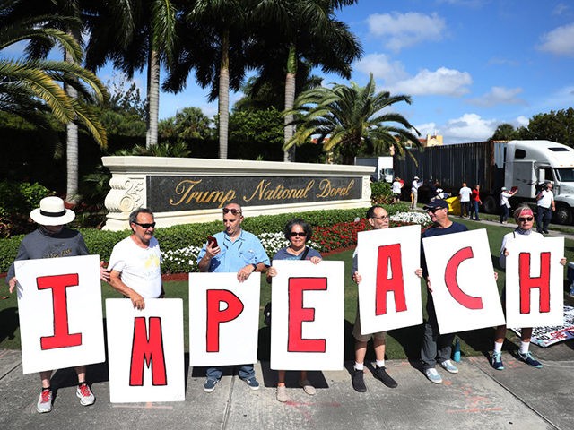 DORAL, FL - DECEMBER 17: Protesters gather outside of the Trump National Doral golf resort