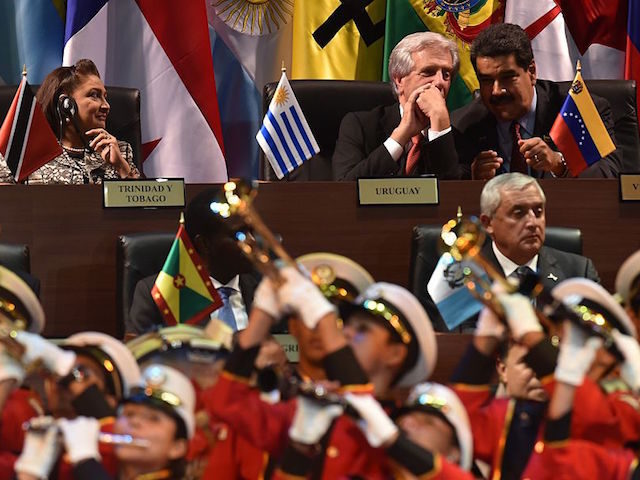 (L to R - top) Trinidad and Tobago's Prime Minister Kamla Persad-Bissessar, Uruguay's President Tabare Vazquez and Venezuela's President Nicolas Maduro and (L to R front) US President Barack Obama, Grenadian Prime Minister Keith Mitchell and Guatemala's Otto Perez attend the opening ceremony of the VII Americas Summit in Panama …