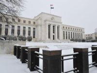 The US Federal Reserve is seen during a snow storm March 3, 2014 in Washington, DC. Snow began falling in the nation's capital early Monday, and officials warned people to stay off treacherous, icy roads a scene that has become familiar to residents in the Midwest, East and even Deep …