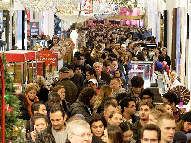 Shoppers crowd the aisles in Macys department store in Herald Square, New York, on November 26, 2015. Many retail outlets opened their doors to bargain hunters looking for Black Friday deals on Thanksgiving day, a day earlier than the traditional start to the sales season. AFP PHOTO/TREVOR COLLENS / AFP …