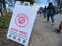 North Carolina State University students head to their precinct to vote in the primaries at Pullen Community Center on March 15, 2016 in Raleigh, North Carolina. The university provided bus transportation throughout the day to the precinct. The North Carolina primaries is the state's first use of the voter ID …