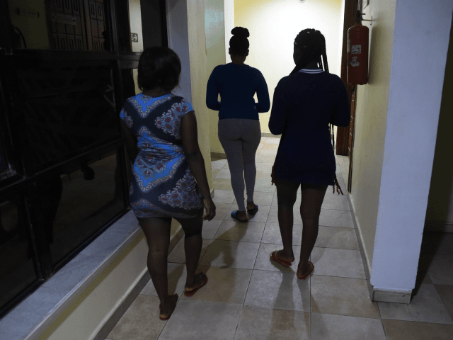 Prostitutes leave an hotel in Benin City, capital of Edo State, southern Nigeria, on March