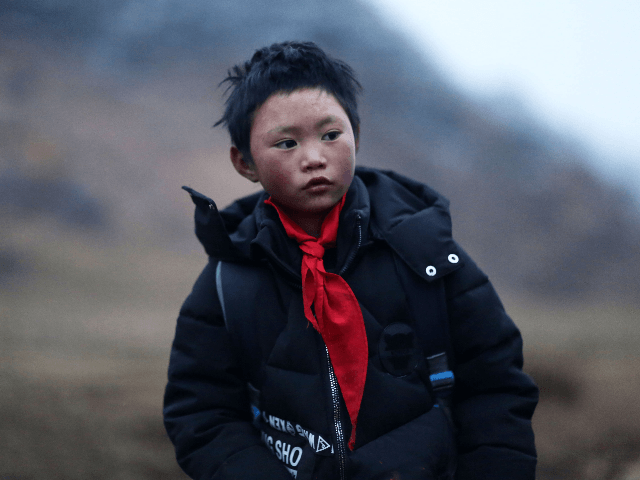 This photo taken on January 11, 2018 shows Wang Fuman, also known as "Frost Boy", in Ludian in China's southwestern Yunnan province. A viral photo of a Chinese boy whose hair is encrusted with ice after his hour-long walk to school in freezing temperatures has stirred debate about the impact …
