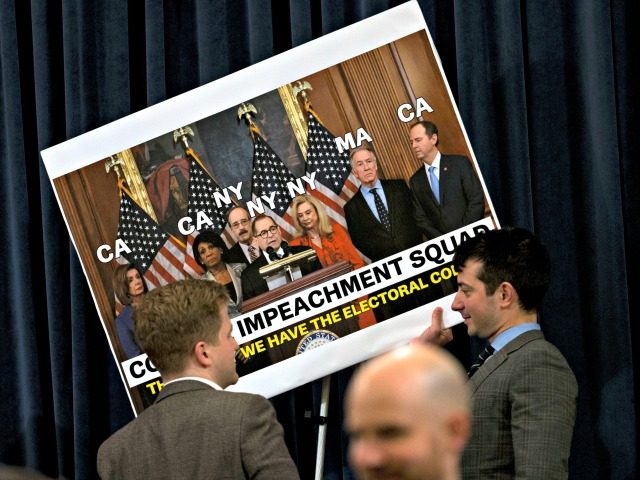 WASHINGTON, DC - DECEMBER 11: House Judiciary Committee staff members remove the signs aft